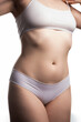© filin174 - Sexy young woman in white lingerie on a white background.