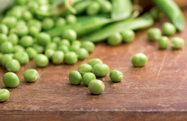 Canvas Print - Green pea on rustic wooden background with copy space, natural wooden table.