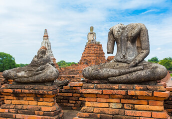 The Body of a stone Buddha image on an old fence at Chaiwatthanaram Temple, Ayutthaya Province Thailand