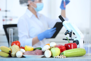Wall Mural - fresh vegetables, fruits and meat on table in laboratory. food quality control