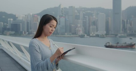 Poster - Woman sketch on tablet computer of cityscape in Hong Kong