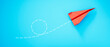 © peterschreiber.media - Red Paper airplane plane on blue background