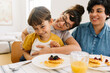 © (JLco) Julia Amaral - Family having fun while having breakfast