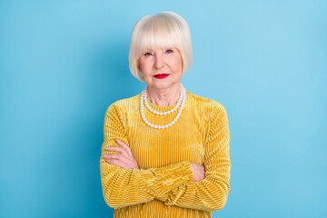 Poster - Photo of strict short hairdo aged lady crossed arms wear blouse necklace isolated on blue color background