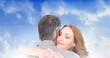 © vectorfusionart - Composition of happy mature couple embracing and smiling, over blue cloudy sky