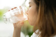 © waranyu - woman drinking fresh water, healthcare concept