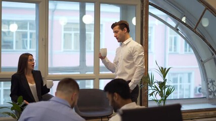 Wall Mural - Group of involved professionals communicate in office workspace discussing brainstorming collaboration and business strategies, male and female partners talking about startup project