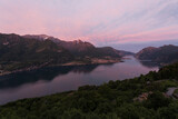 Fototapeta Na ścianę - Sunset view over Lecco branch of lake Como from Civenna with pink sky.
