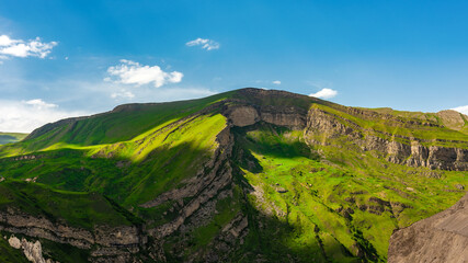 Green mountains and blue clouds landscape