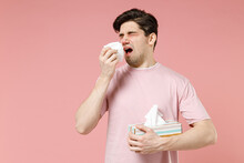Sick Unhealthy Ill Allergic Man Has Red Watery Eyes Runny Stuffy Sore Nose Suffer From Allergy Trigger Symptom Hay Fever Hold Paper Napkin Handkerchief Isolated On Pastel Pink Color Background Studio