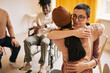 © Seventyfour - Portrait of female psychologist embracing young woman during therapy session in support group, copy space