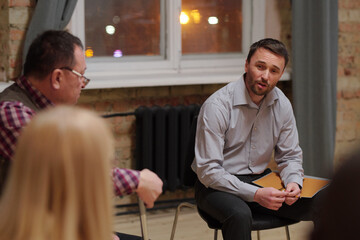 Wall Mural - Mature and middle aged men discussing psychological problems during session