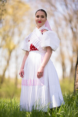 Young beautiful slovak woman in traditional dress. Slovak folklore