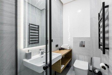 interior photo, small bathroom, with white marble tiles, and shower