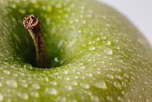 Closeup Of Green Apple With Water Drops