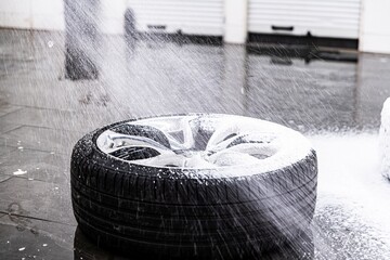 Wall Mural - Cleaning car wheel and tire with active foam and pressure washer