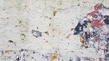 Fototapeta  - Old peeling wall, with several layers of damaged paint, of various colors