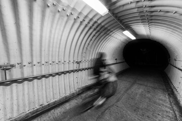 Poster - biker riding on bicycle in tunnel