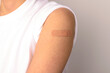© 희연 황 - Forearm of a person with a sticking plaster on a white background