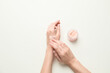 © Pixel-Shot - Female hands with body scrub on light background