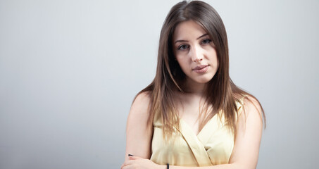 Poster - Beautiful young woman with bare shoulders looks at the camera