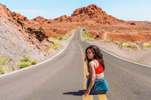 Beautiful Young Girl In A Denim Skirt On A Scenic Road In Valley Of Fire, Nevada