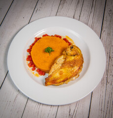 Chicken supreme recipe, gently cooked with 5 spices, sweet potato mousseline, peppers cut in half. High quality photo