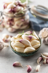 Wall Mural - Ripe and aromatic homegrown garlic served in the blue rustic bowl