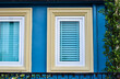 © Kongkit - vintage windows on the blue wall