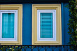 © Kongkit - vintage windows on the blue wall