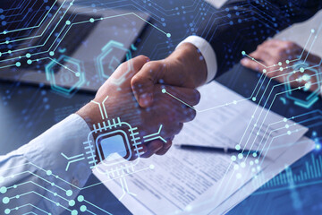 handshake of two businessmen who enters into the contract to develop a new software to improve busin