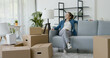 © StockPhotoPro - Happy woman moving in her new home
