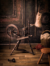 Antique Spinning Wheel In Old Room