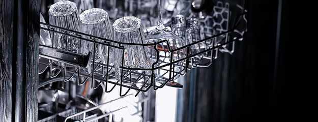 dishes in an open dishwasher, home style lifestyle, cleanliness and convenience background