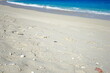 Footprints of human feet on the sand near the water on the beach. Furuzamami Beach in Zamami island, Okinawa, Japan. Image of summer vacation. - 日本 沖縄 座間味島 古座間味 ビーチ 足跡