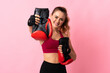 © luismolinero - Young Brazilian woman isolated on pink background with boxing gloves