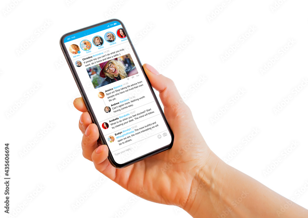 Person holding mobile phone in hand with sample social media microblogging app on the screen - obrazy, fototapety, plakaty 