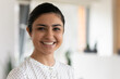 © fizkes - Head shot portrait of confident successful smiling Indian businesswoman standing in office, happy entrepreneur employee executive looking at camera, posing for corporate photo, profile picture