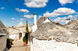 © robertharding - Traditional whitewashed Trulli houses, Alberobello, UNESCO World Heritage Site, province of Bari, Apulia, Italy