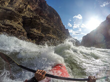 Skip Brown Paddles His Whitewater Kayak Through Rapids On The Colorado River Through The Grand Canyon, Arizona