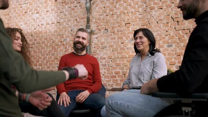 Wall Mural - Group of people on therapy session having fun, mature man looking at camera.