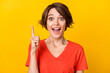 Portrait of astonished cheerful person point finger open mouth cant believe isolated on orange color background