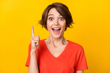 Sticker - Portrait of astonished cheerful person point finger open mouth cant believe isolated on orange color background