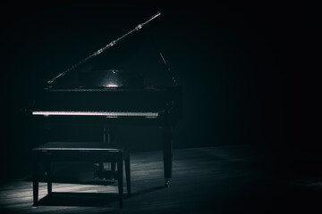 small grand piano in dark room vintage style