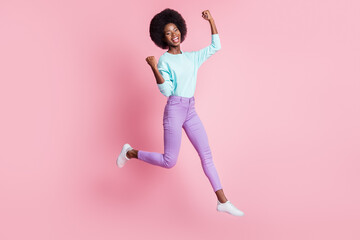 Canvas Print - Full length photo of lucky cute dark skin lady wear colorful clothes rising fists jumping high isolated pink color background