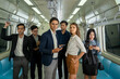 © visoot - Business people and office worker with smartphone in subway while traveling to work passengers traveling concept.