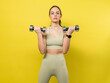 © Thomas - young girl in sports clothes doing exercise with dumbbells