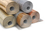 Rolled up linoleum stacked in different variations on white background, 3d illustration