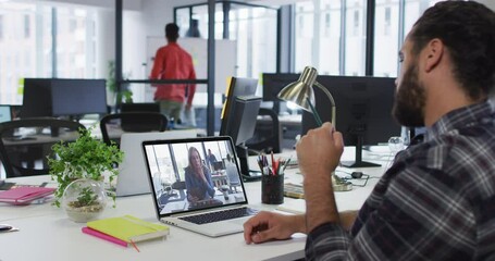 Poster - Middle eastern man having a video call with female colleague on laptop at office