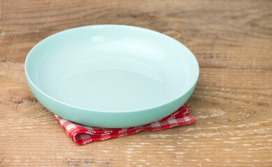 Empty plate on wooden table